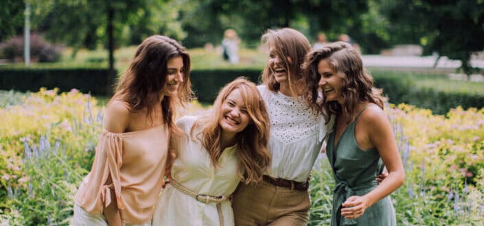 Happy people standing at a garden