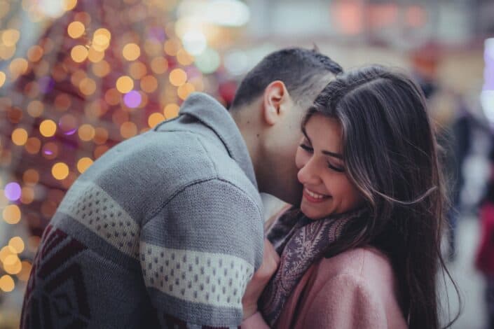 man kissing his girlfriend