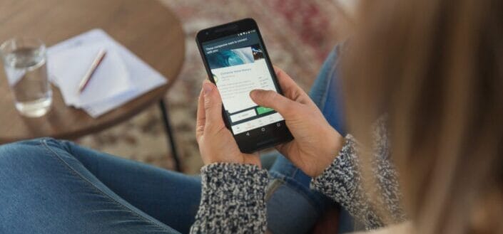 Person browsing through smartphone