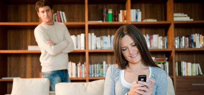 woman looking at mobile phone