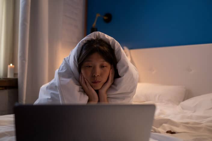 woman watching movie on laptop