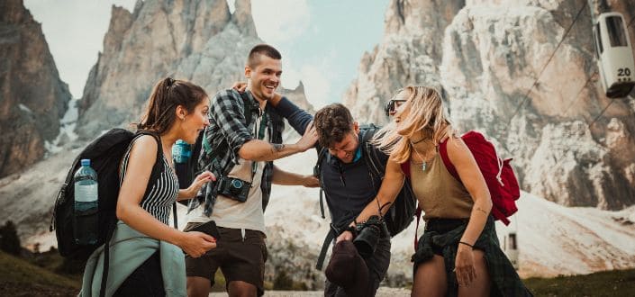 Group of friends playing while hiking