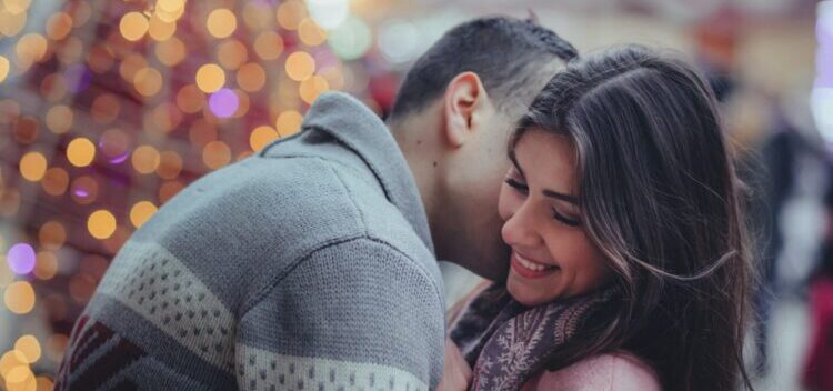 man trying to kiss his girlfriend