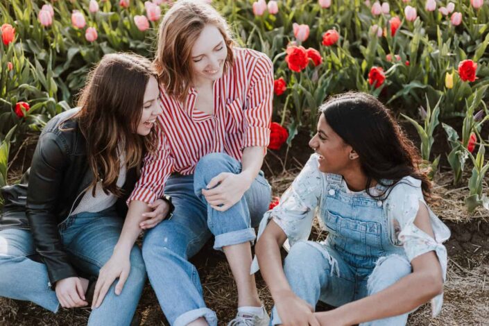 Women Sitting Near the Flower Bed