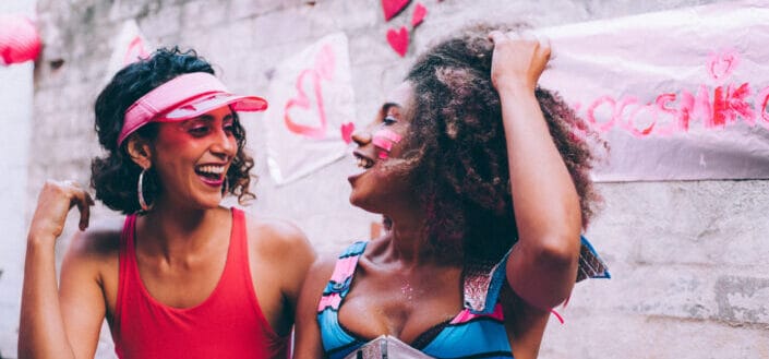 Two women laughing at each other