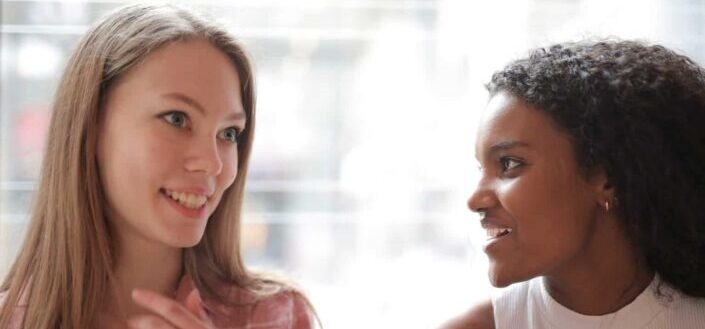 Two Women Talking With Each Other