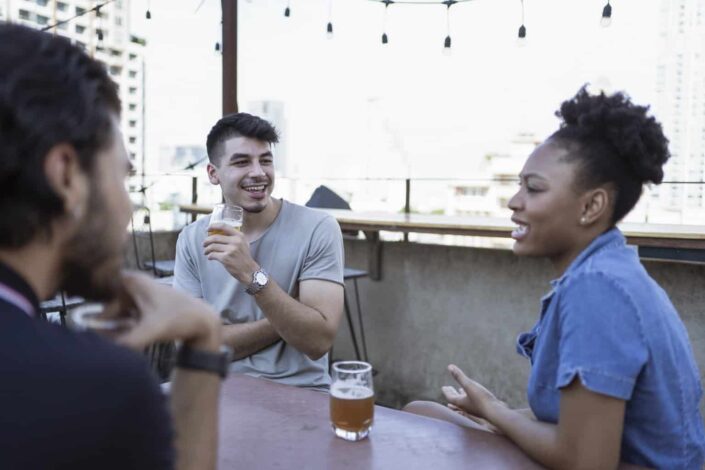 A Group of Friends Catching Up While Having Drinks