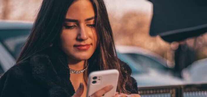 Stylish Woman Holding Her Cellphone