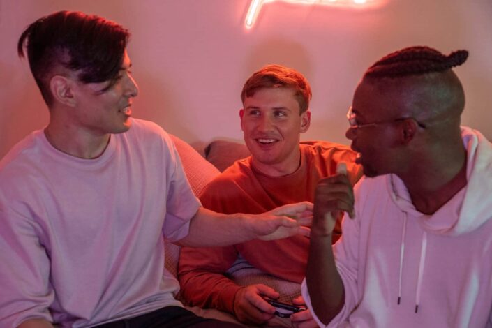 Friends Having a Fun Conversation While Sitting Together
