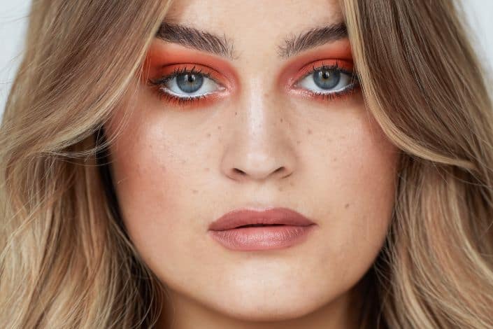 Woman With Blonde Hair and Red Eyeshadow