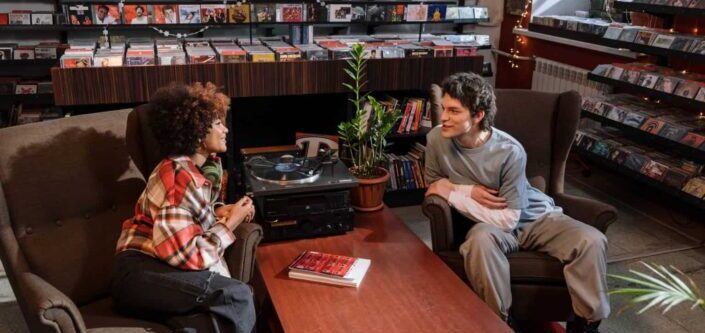 Man and a Woman Talking in a Vinyl Shop