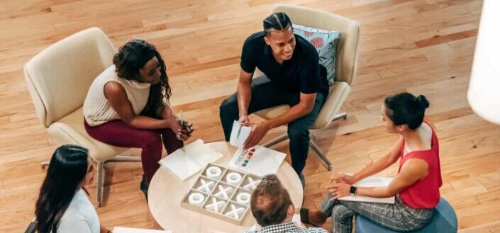 Officemates in the Lobby Having a Discussion