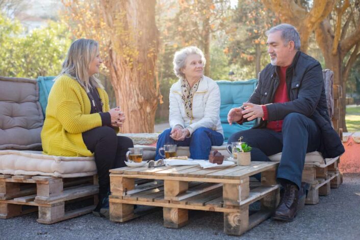 Adults Talking While Having Tea