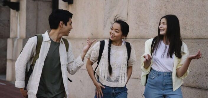 Group of Friends Talking While Walking