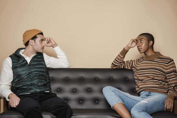 Serious couple on couch