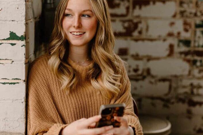 Woman Using Her Phone Indoors