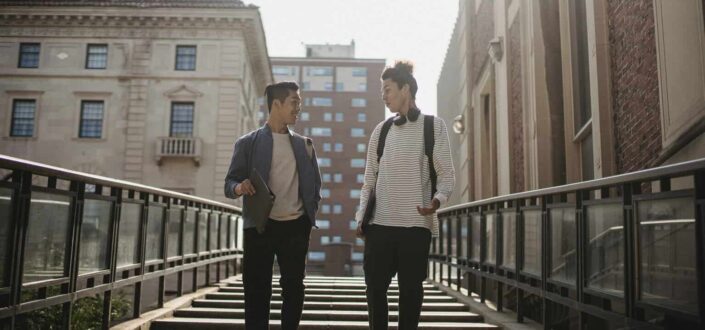 Stylish Friends Walking Downstairs in Campus