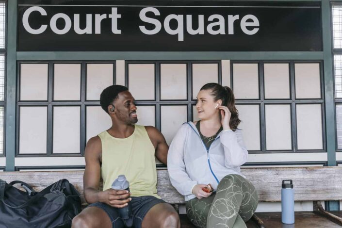 A Man and Woman in Gym Clothes Looking at Each Other