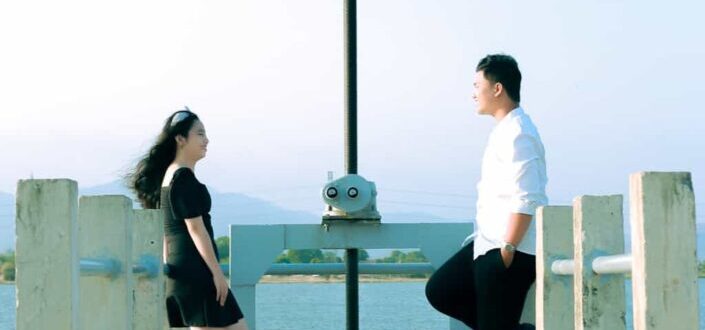 Man and Woman Standing on the Bridge