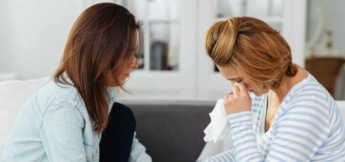 woman comforting a crying friend