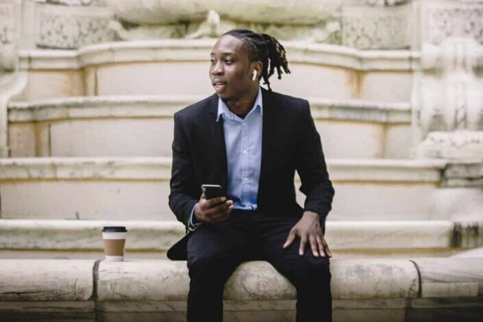 man with smartphone having coffee break