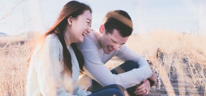 Man and Woman Laughing at the Field
