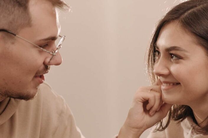Man and Woman Looking At Each Other