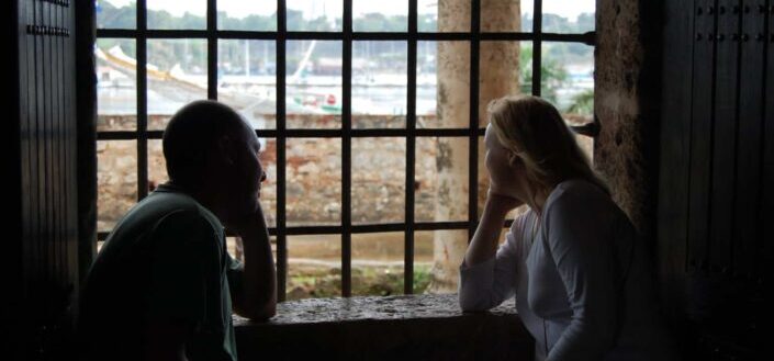 Man and Woman Staring Beside the Window