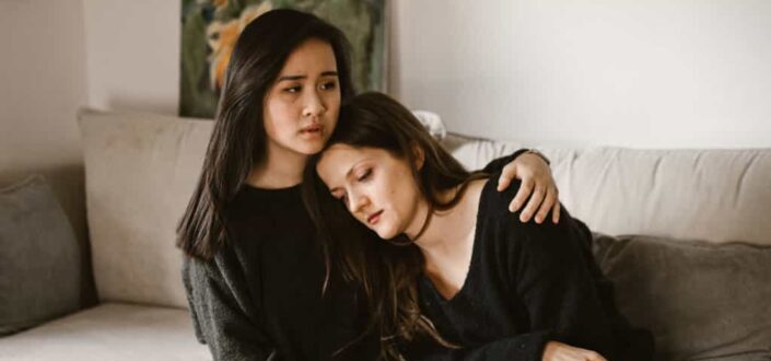 Person comforting the crying woman
