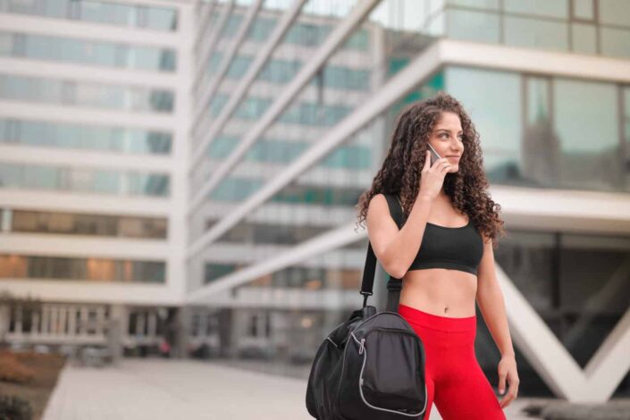 Woman in Gym Clothes on the Phone