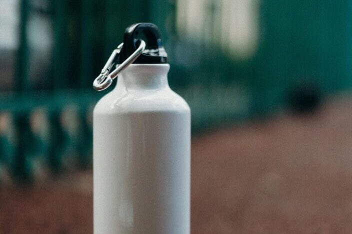 White Stainless Water Bottle on the Ground