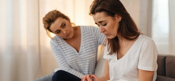 Woman comforting her friend