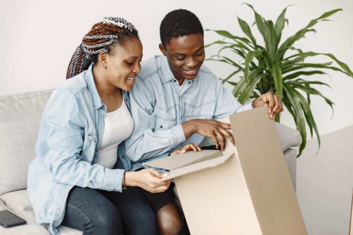 A couple opening a cardboard box together