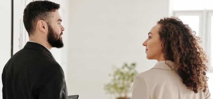A man looking at a woman