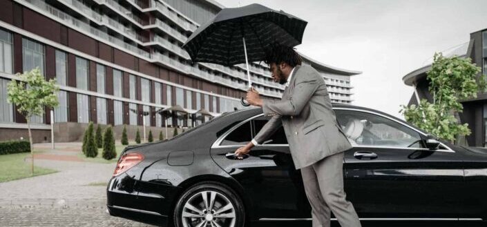 Man Opening a Car Door