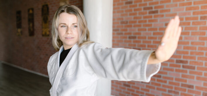 A woman in karate position