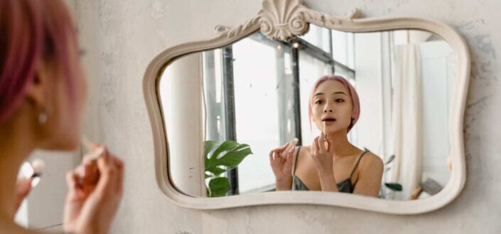 A woman looking at the mirror