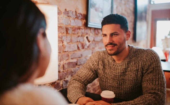 Couple sitting at cafe together