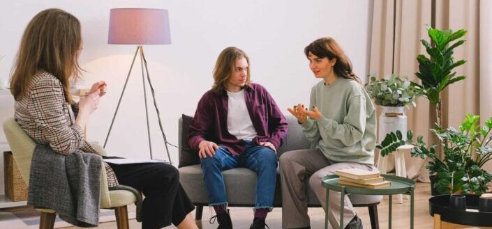 Couple talking with psychologist