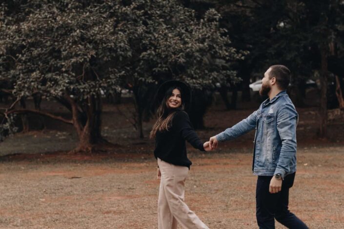 Couple walking in a park holding hands