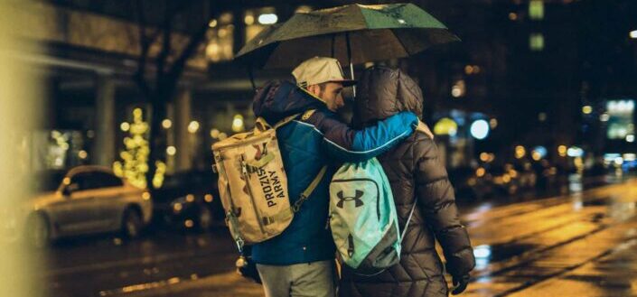 Couple Walking Under the Rain At Night