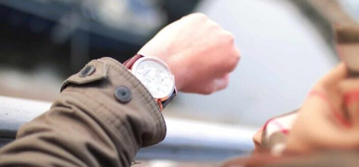 Man looking at his wrist watch