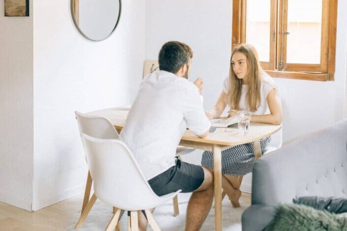 Man and woman sitting at table