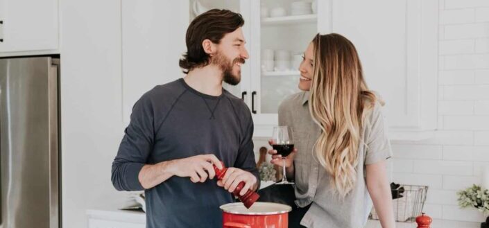 man and woman in kitchen