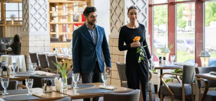Man and woman walking at the restaurant