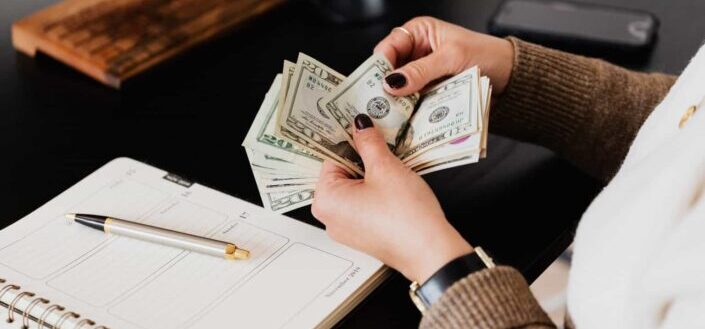 Person counting cash money