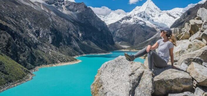 young woman gazing at beautiful mountain scenery