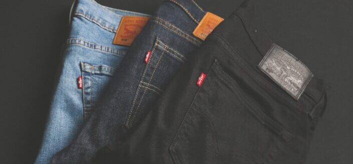 three assorted-color denim bottoms