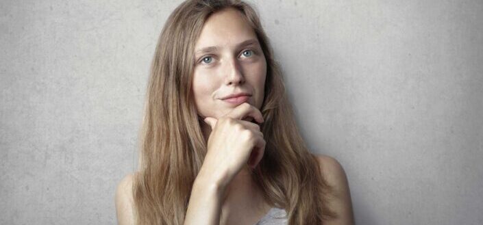 Woman holding her chin