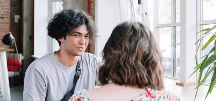 Woman and Man Talking in a Cafe